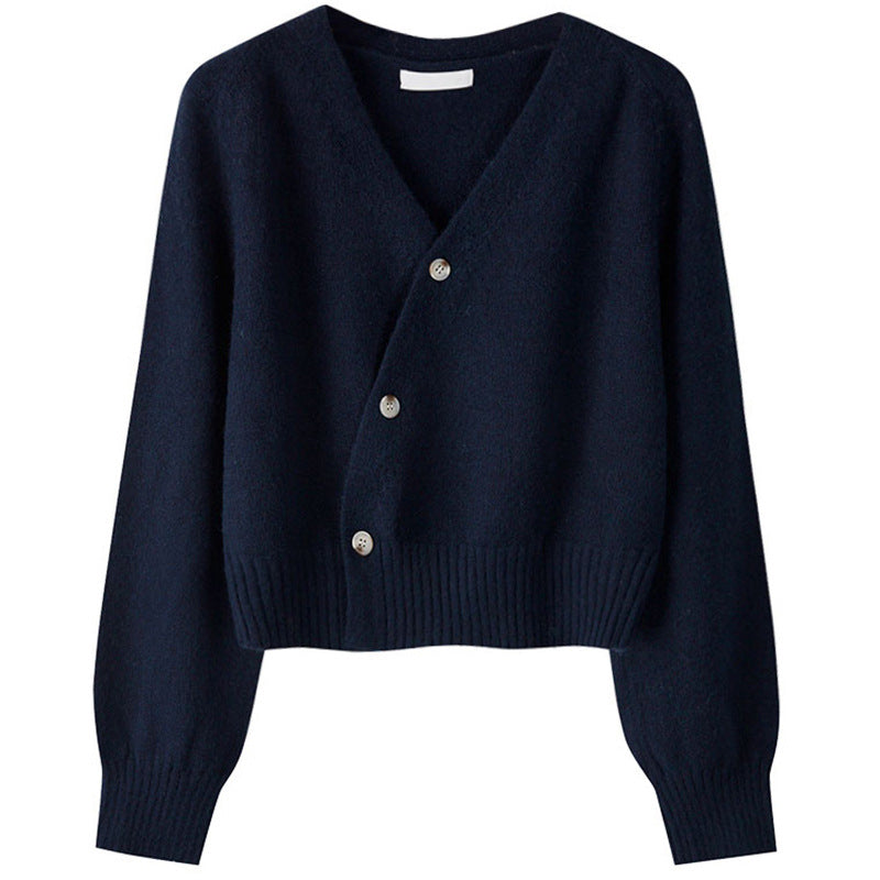 Navy blue cardigan with buttons on a white background