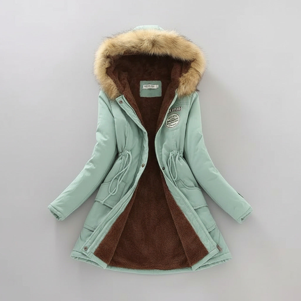Light blue coat with fur hood on a light background