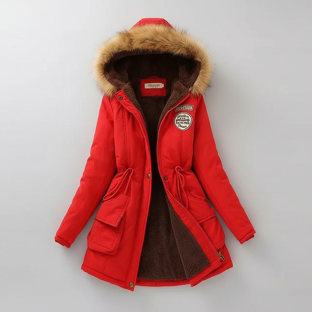 Red winter coat with fur-lined hood on a light background