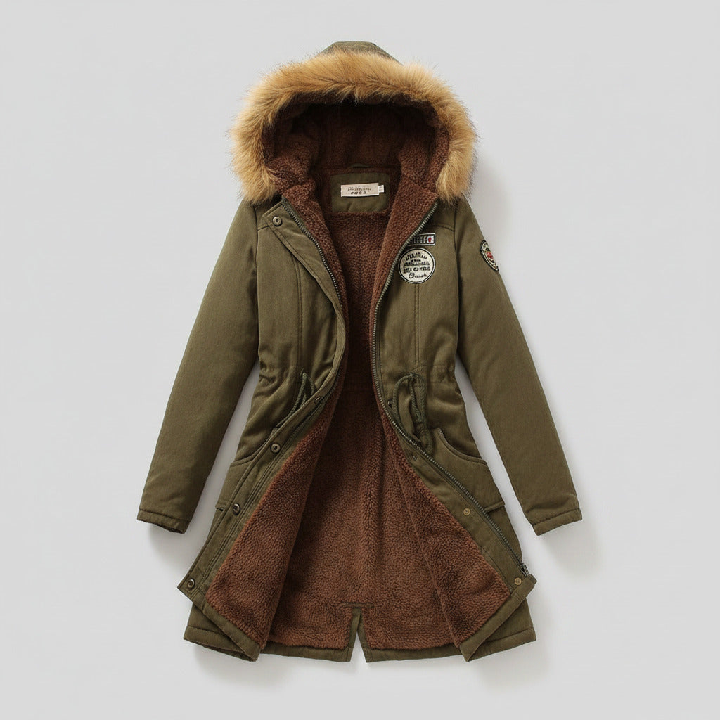 Green winter coat with fur hood on a light background