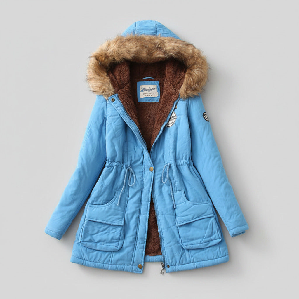 Blue winter coat with fur-lined hood on a beige background