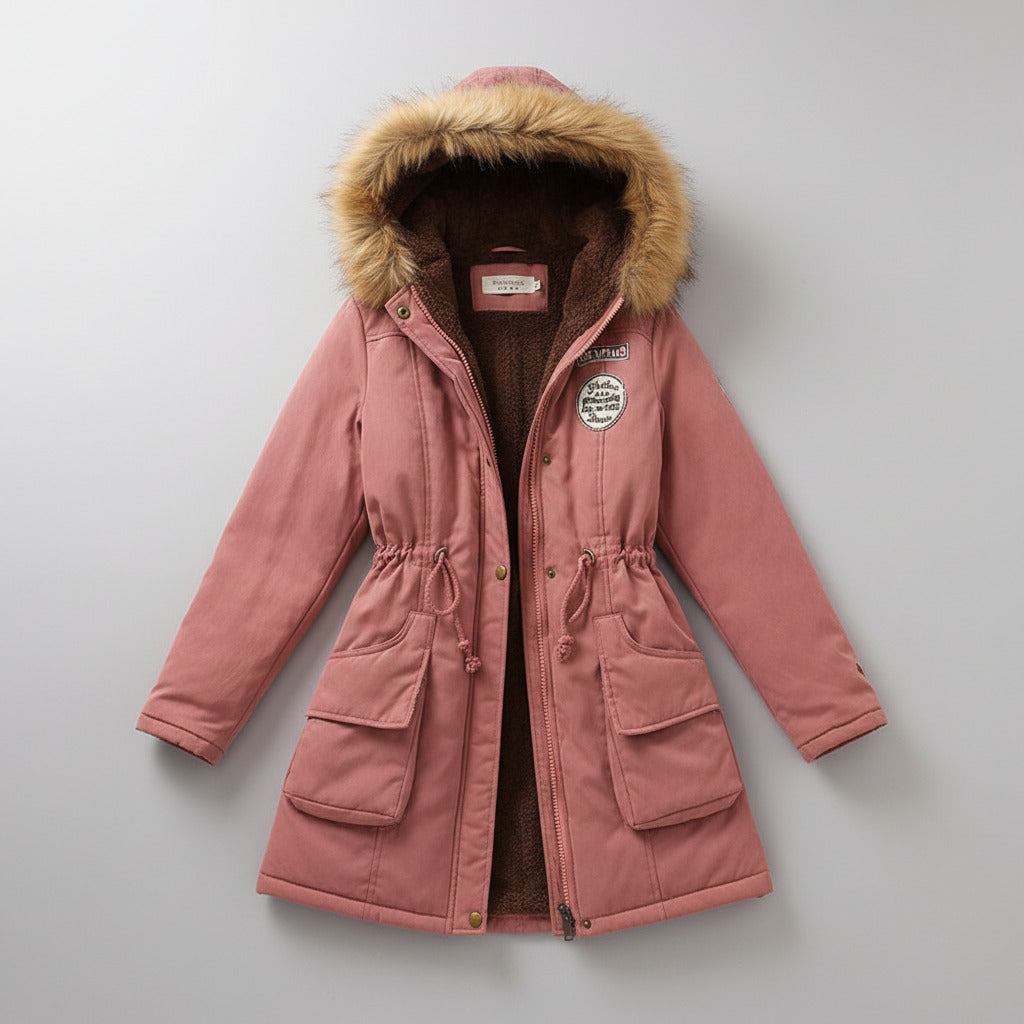 Pink winter coat with fur hood on a light background