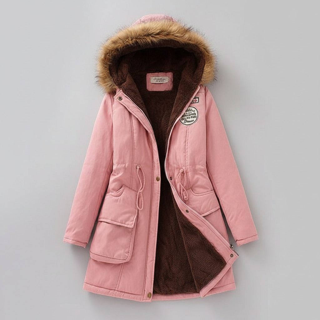 Pink coat with fur hood on a light background