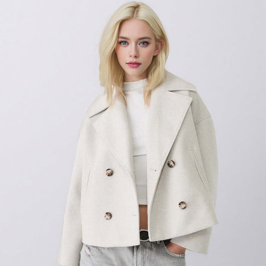 Woman wearing a beige coat on a white background
