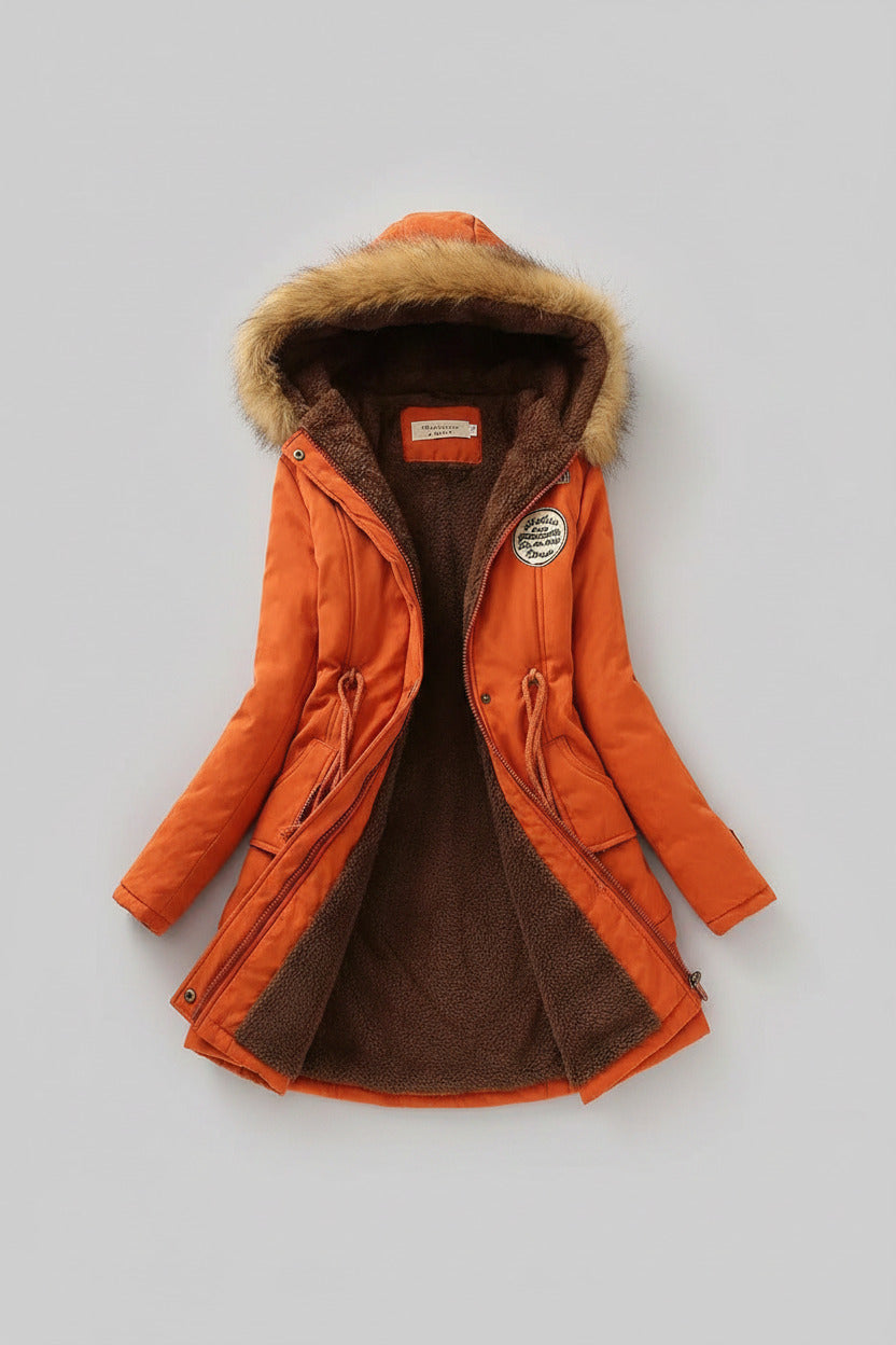 Orange winter coat with fur hood on a light background