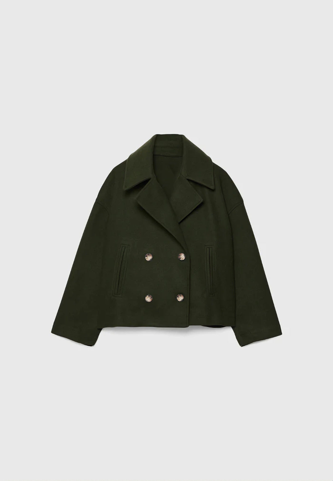Green jacket with pearl buttons on a light gray background