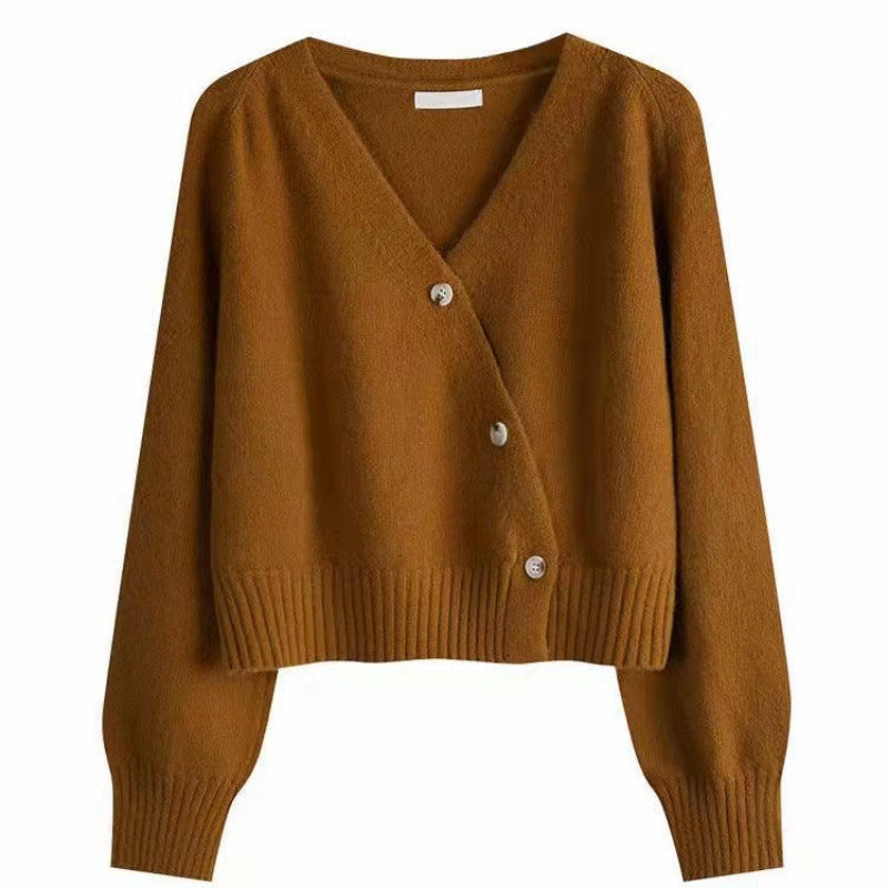 Brown cardigan with buttons on a white background