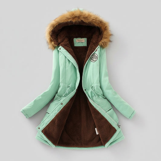 Mint green parka coat with fur hood on a light background